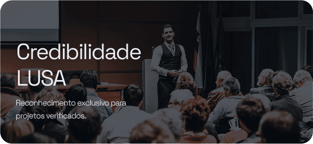 LUSA Credibility — be recognized worldwide for your excellence. A speaker in front of a packed auditorium.